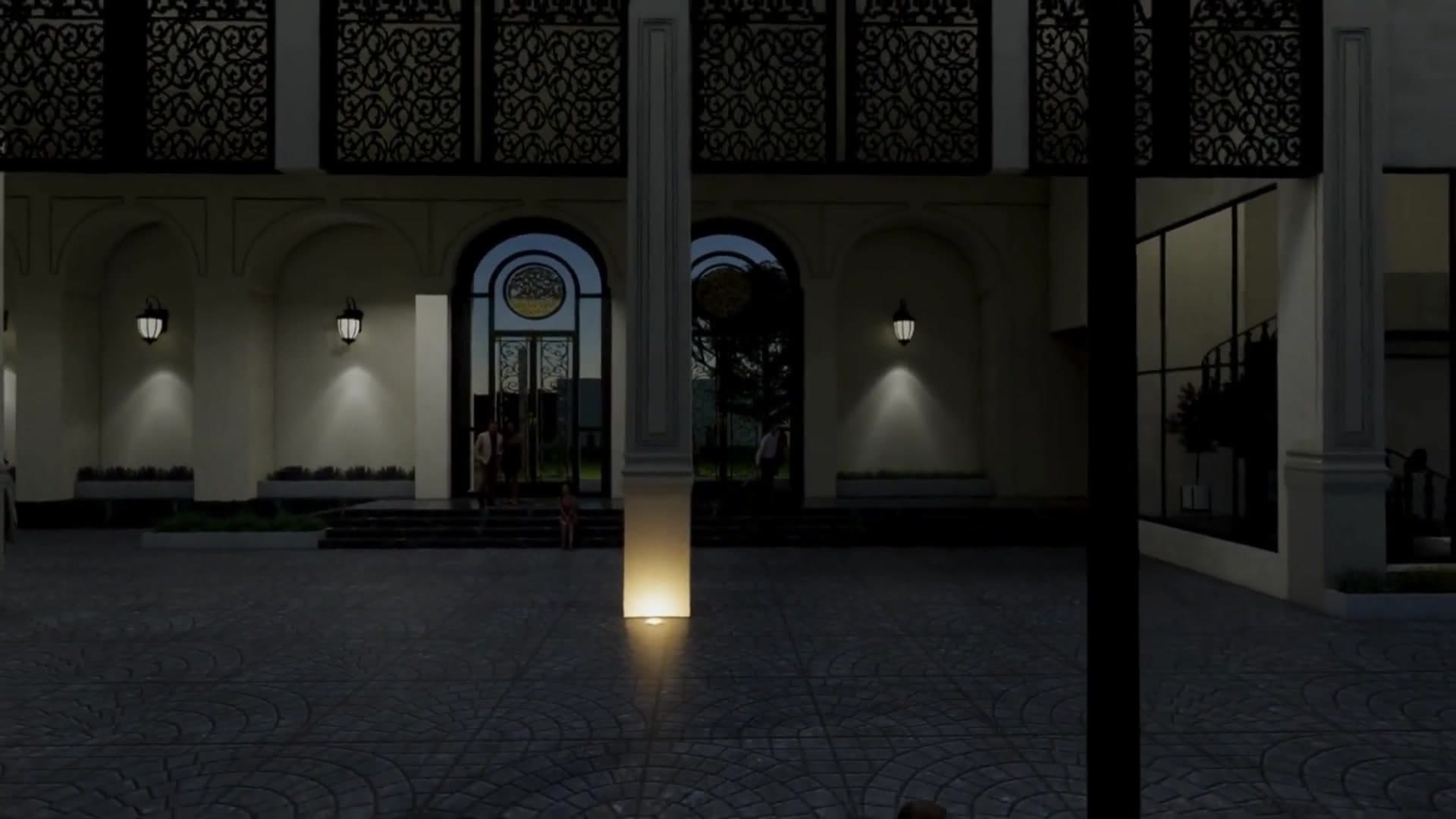 Night view of ornate ironwork entrance and ambient lighting